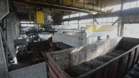 Loading into a wagon, production of balls, Electromagnetic crane with metal ball Stock-Footage 124248051