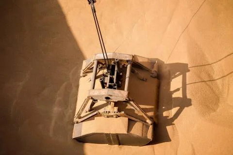 Loading wheat on cargo ship with crane and bucket. Shipment from a merchant s Stock Photos