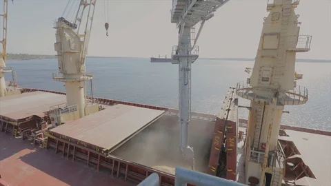 Loading wheat into a cargo ship for transportation by sea. The ship is loaded Stock-Footage 122215517