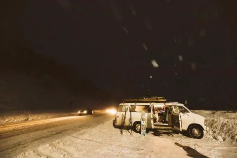 Loading up white camper van after long day skiing Stock Photos