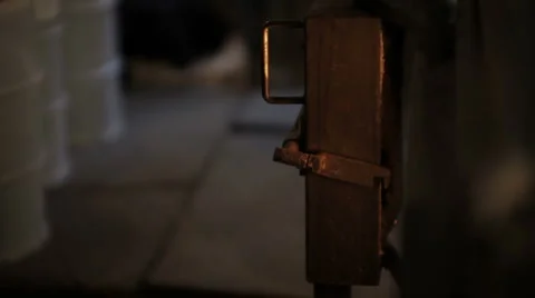 Loading Wood Into Maple Sap Evaporator and Closing Hatch Stock Footage 5503555