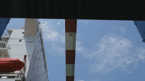 Loading\Unloading container to ship by industrial line gantry crane 4k creative  Stock Footage 136355403