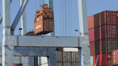 Loading\Unloading container to ship by industrial line gantry crane 4k creative  Stock Footage 139930323