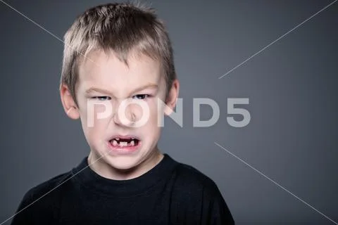 Loads of aggression in a little boy Stock Photos