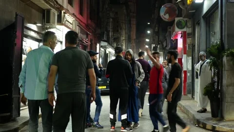 Loads of people on the street on a warm spring night Stock Footage 293310804