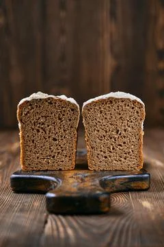 Loaf of artisan rye bread cut on half Stock-Fotos