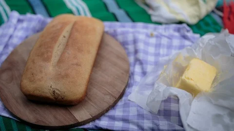 Loaf of bread and butter on the table Vídeos de archivo 94882731