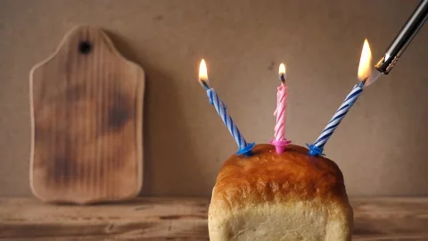 Loaf of bread and candle - happy birthday idea. Japanese soft and fluffy bun Stock Footage 172190095