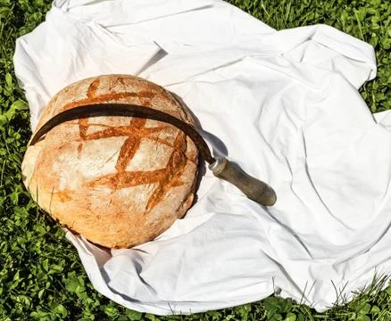 Loaf of bread and hammer Stock Photos