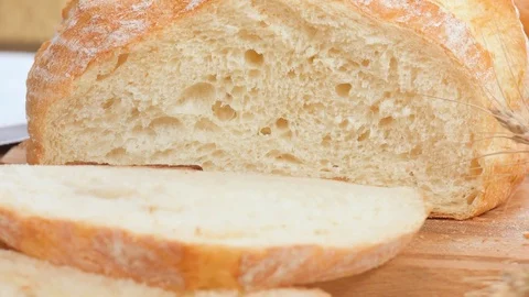 Loaf of bread and sliced white bread . 動画素材 74074941