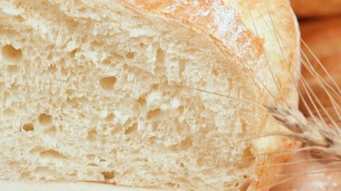 Loaf of bread and sliced white bread . 動画素材 74075048