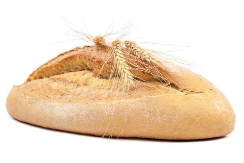 Loaf of bread and wheat ears. Stock Photos