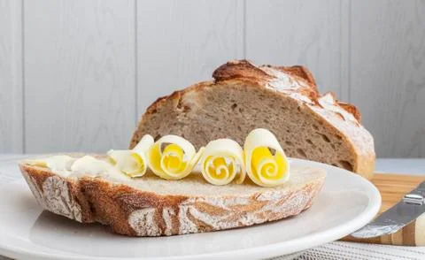 A loaf of bread with butter Stock Photos