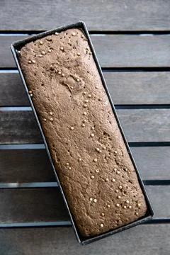 Loaf of bread with coriander seeds ready to be baked. Bread on the table Stock Photos