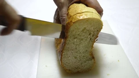 A Loaf of Bread Cut With a Knife Stock Footage 81795974