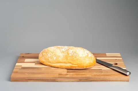 Loaf of Bread on Cutting Board with Knife Stock Photos
