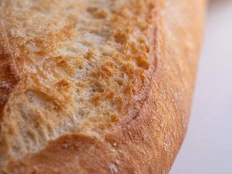 A loaf of bread is displayed with its crust showing clear texture Stock Photos