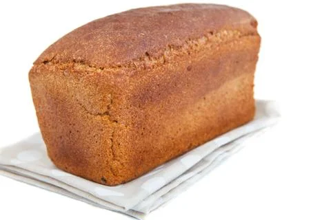 Loaf of bread on doily isolated on white Stock Photos