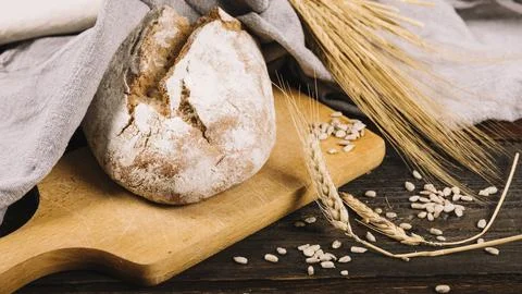 Loaf bread ear wheat dark wooden background 스톡 사진