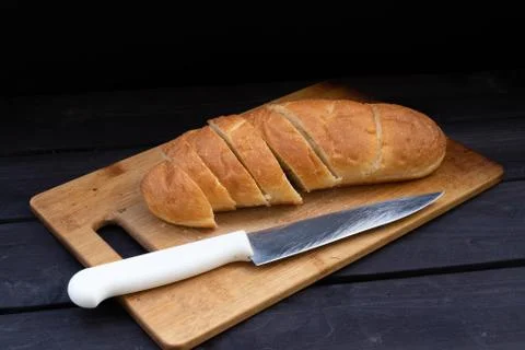 Loaf of bread with a knife Foto stock