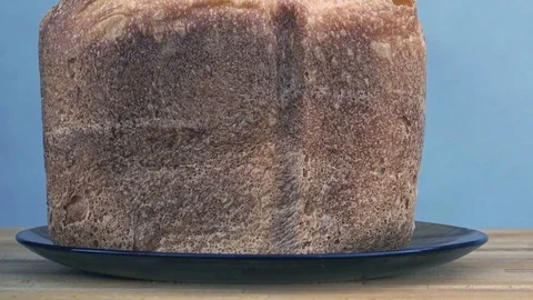 Loaf of bread in a plate on the table Stock Footage 72001667