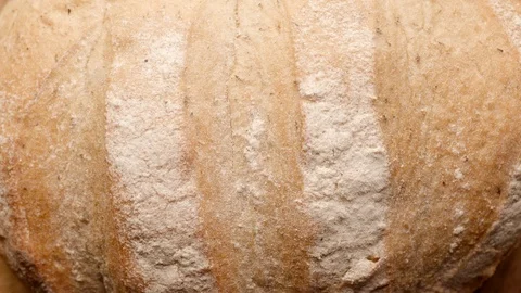 Loaf of bread rotates in a circle Stock Footage 119896649