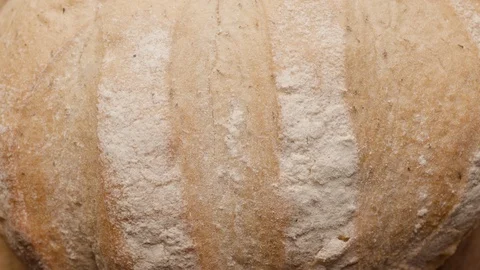 Loaf of bread rotates in a circle UNGRADED Stock Footage 119896613