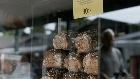 Loaf of bread on sale in display window breads bakery baker restaurant Stock Footage 167591479