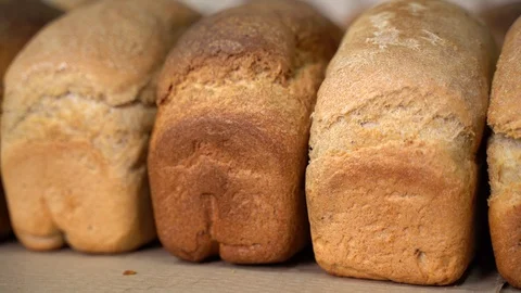 Loaf of bread on a shelf in a store Видео 127312542