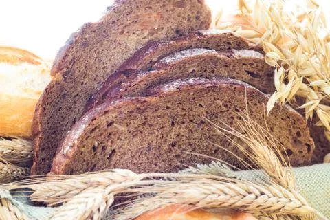 Loaf of bread sliced ??with crispy rolls 스톡 사진