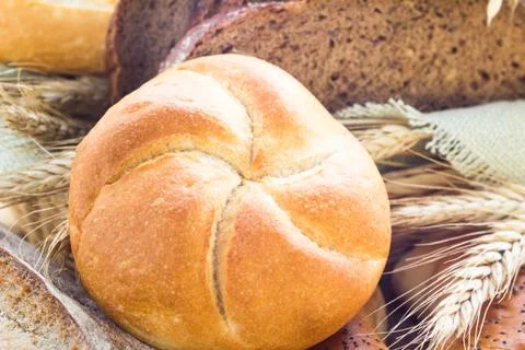 Loaf of bread sliced ??with crispy rolls Stock Photos