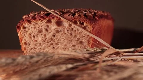 A loaf of bread with spikelets of wheat in a twist Stock Footage 201517034