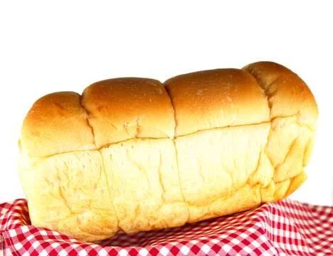 Loaf of bread on tablecloth Stock Photos