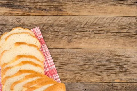 Loaf of bread on a wooden table. Stock Photos