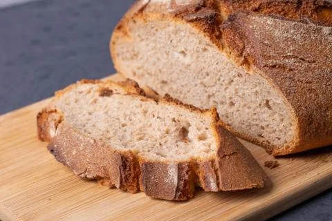 Loaf of brown bread on tone surface Stock Photos
