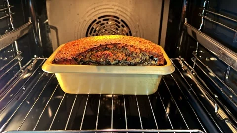 Loaf Cake Baking in Oven With Golden Crust Rising Stock Footage 337386045