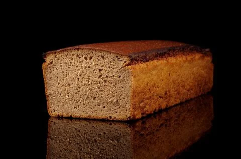 Loaf of dark rye bread isolated Stock Photos