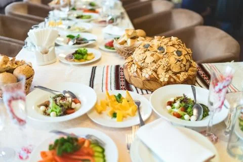 The loaf on the festive table. Stock Photos