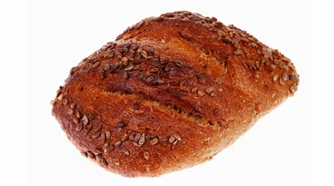 Loaf of french rye bread topped with sunflower 스톡 동영상 24404274