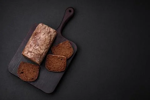 Loaf of fresh crispy brown bread with grains and seeds Stock Photos
