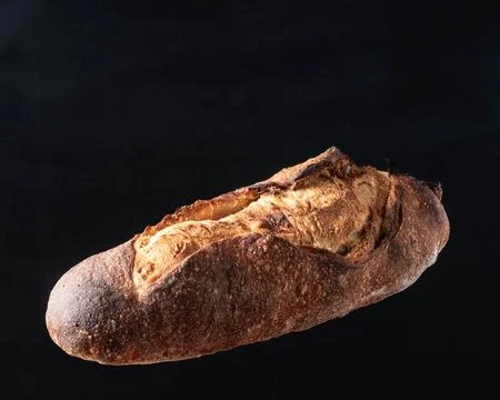 A loaf of gray bread with figs hung in the air. Foto stock