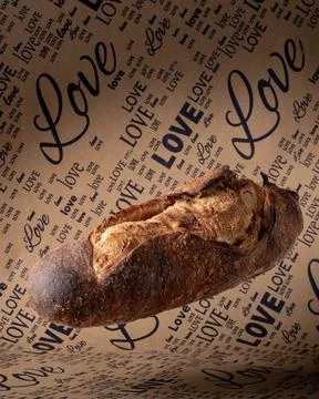 A loaf of gray bread with figs hung in the air. Stock-Fotos