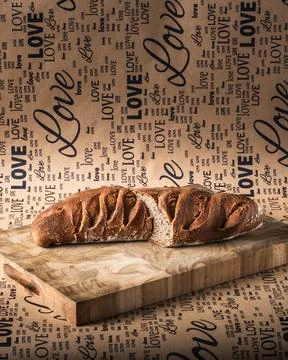 A loaf of gray bread with figs hung in the air. Stock Photos