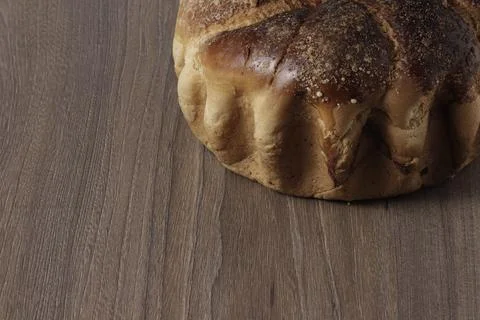 A loaf of round bread on the table close-up. Stock Photos