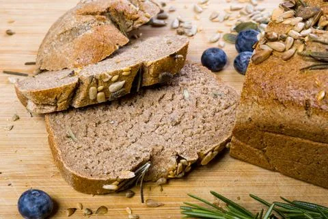 Loaf of rye bread cut in some slices Stock Photos