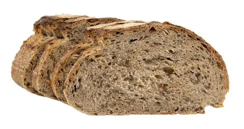 A loaf of rye or wheat bread with flax and sunflower seeds on a white backg.. Stock Photos
