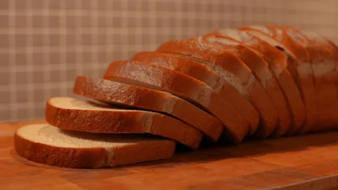 Loaf of sliced bread in kitchen, tracking shot Stock Footage 76188800