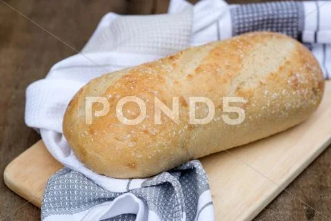 Loaf of sourdough bread in rustic kitchend setting Stock Photos