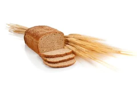Loaf of wheat bread and shocks of wheat Stock Photos