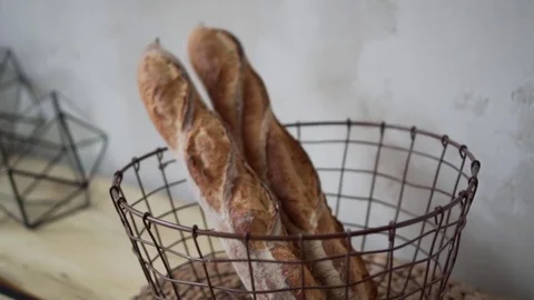 Loaf white bread on the table in basket Stock Footage 85047817